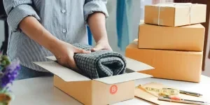 E-commerce order being packed for delivery