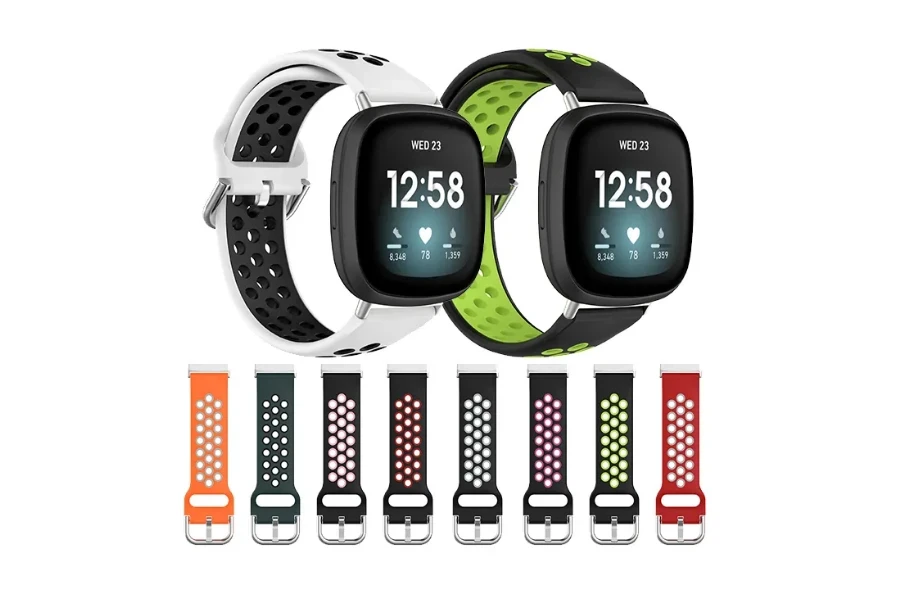 Relojes Fitbit Versa 4 y pulseras multicolores.