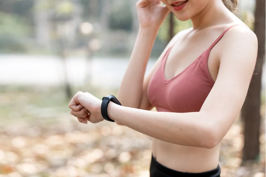 Lady checks heart rate on her smartwatch