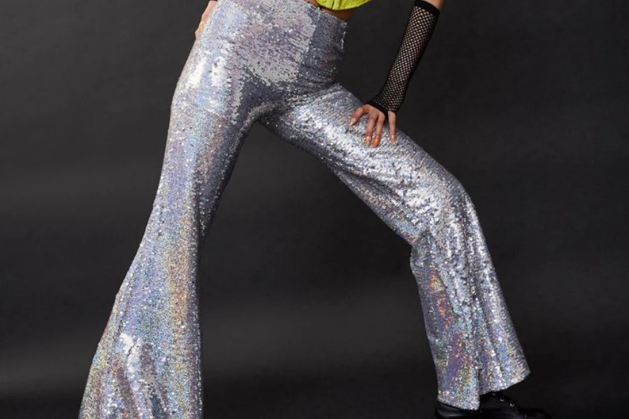 Lady posing in glam-inspired flared trousers