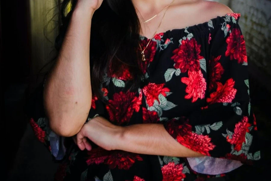 Lady wearing a dress featuring dark florals