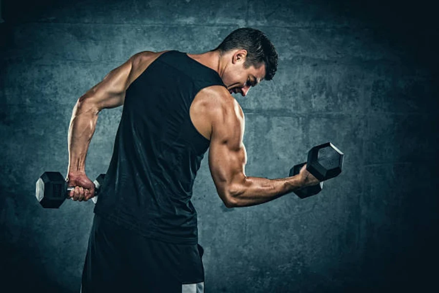 Man doing bicep curl with iron hexagonal dumbbells