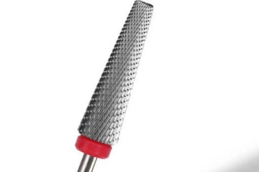 One carbide nail drill bit with a red color code