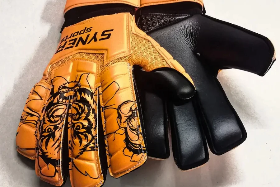 Orange and black goalie gloves with tiger face insignia