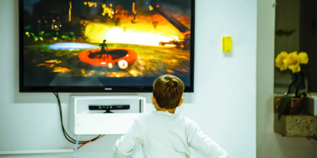 Person playing a game on a TV