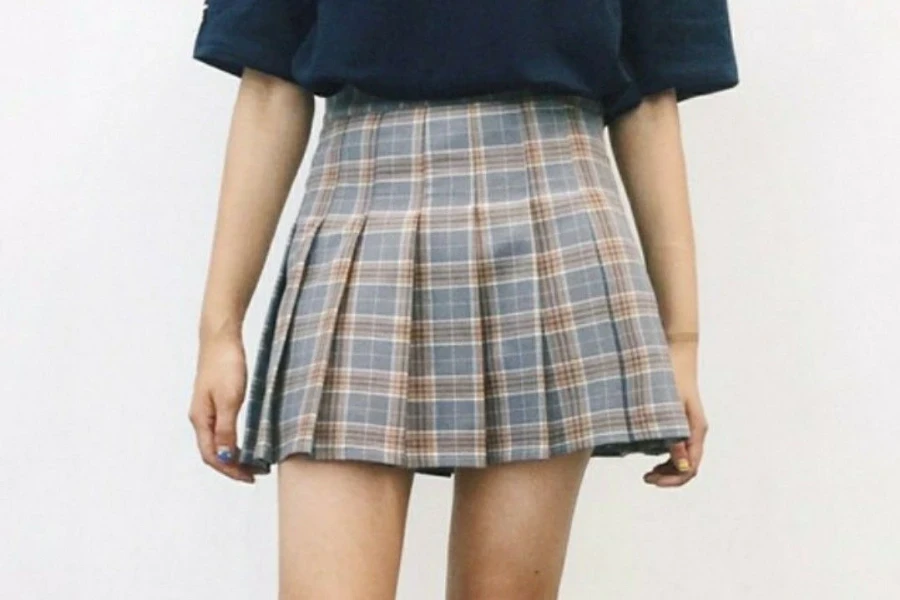 Posing woman rocking an attractive plaid skirt