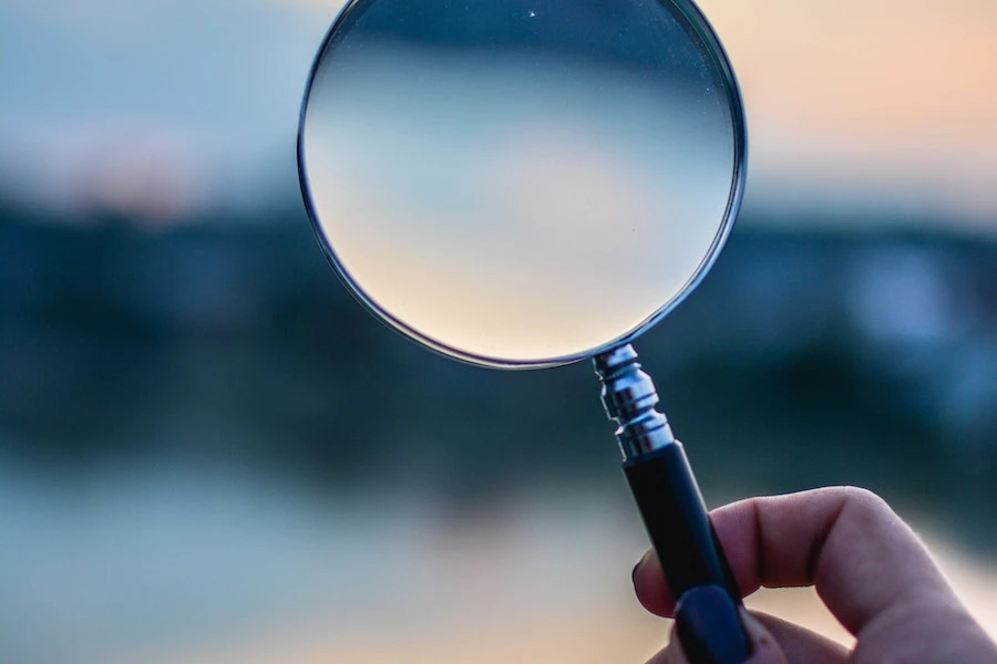 Selective focus photo of magnifying glass