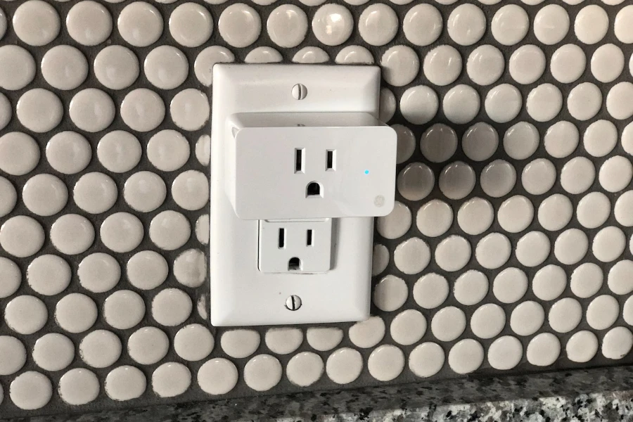 Smart plug plugged into a traditional outlet