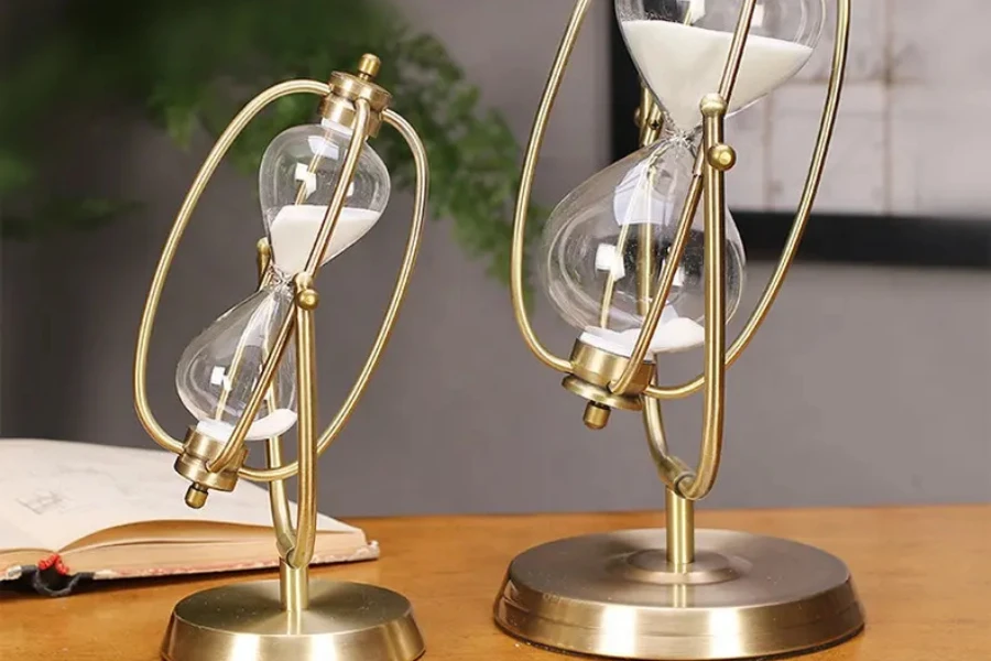 Two contemporary metallic hourglasses