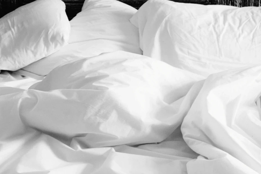 White sheets and pillows on a bed