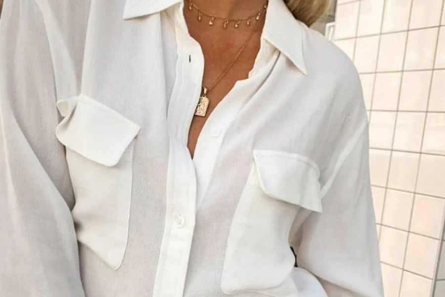 Woman in a slightly unbuttoned button-down shirt