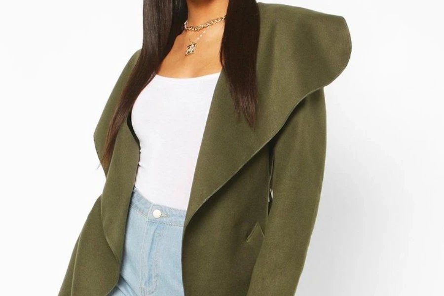 Woman rocking a dark green shawl jacket