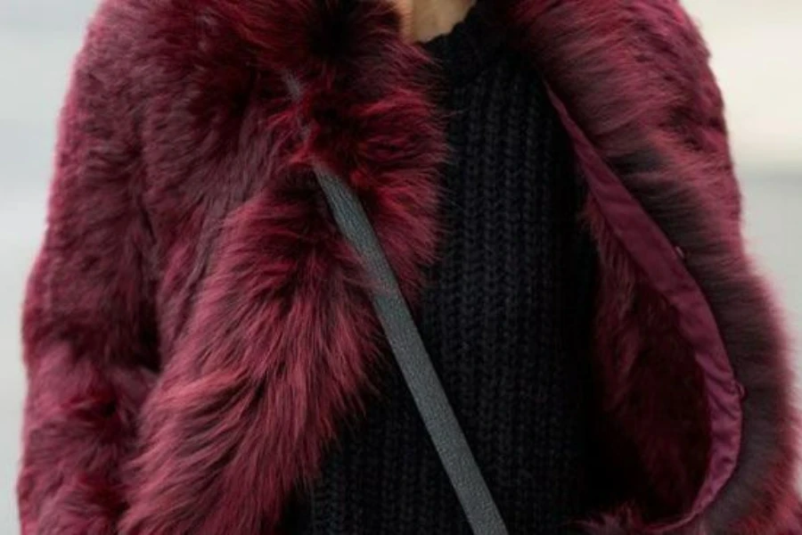 Woman rocking a red statemen coat