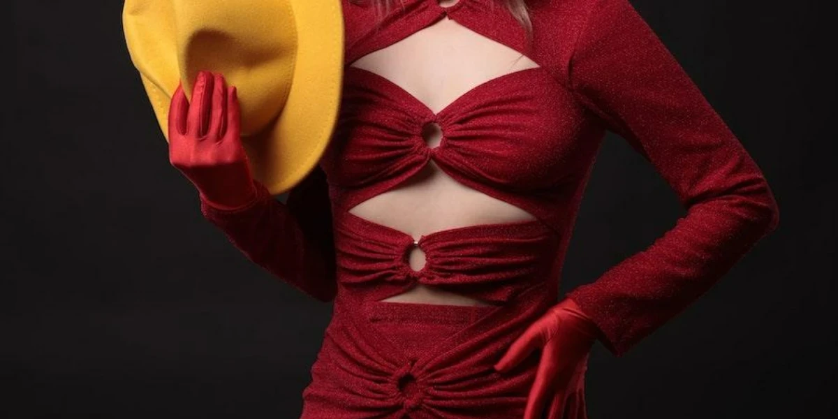 Woman wearing a lustrous red, dark romance outfit