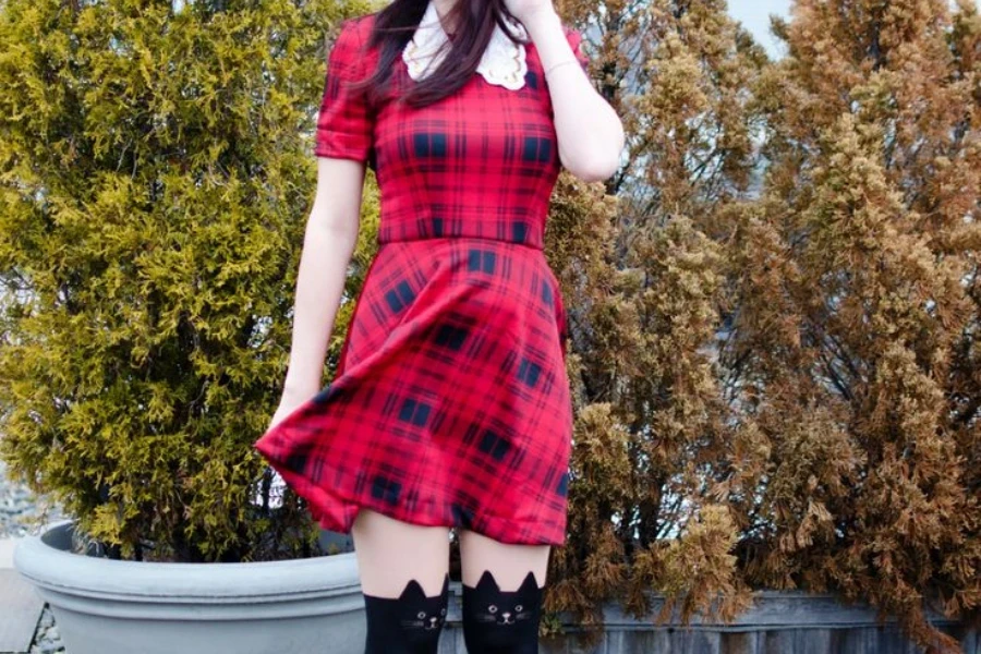 Woman wearing a red plaid skater dress