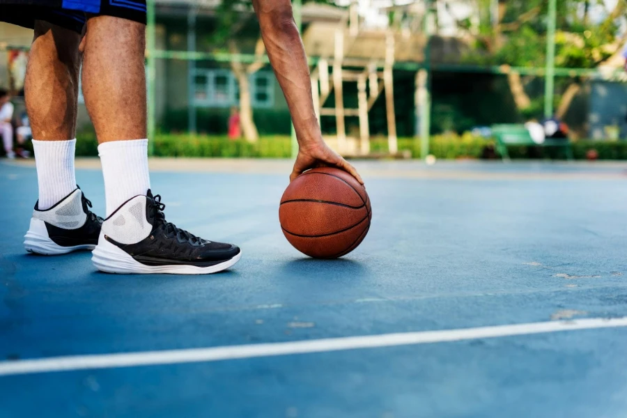 A basketball player in outdoor basketball shoes