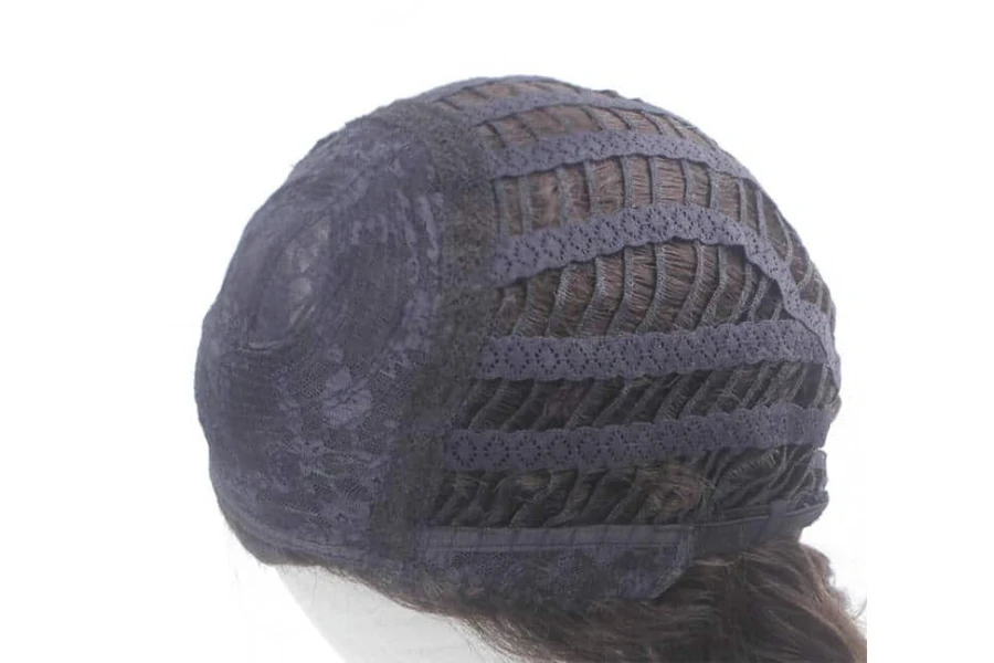 A black basic wig cap sewn to a wig