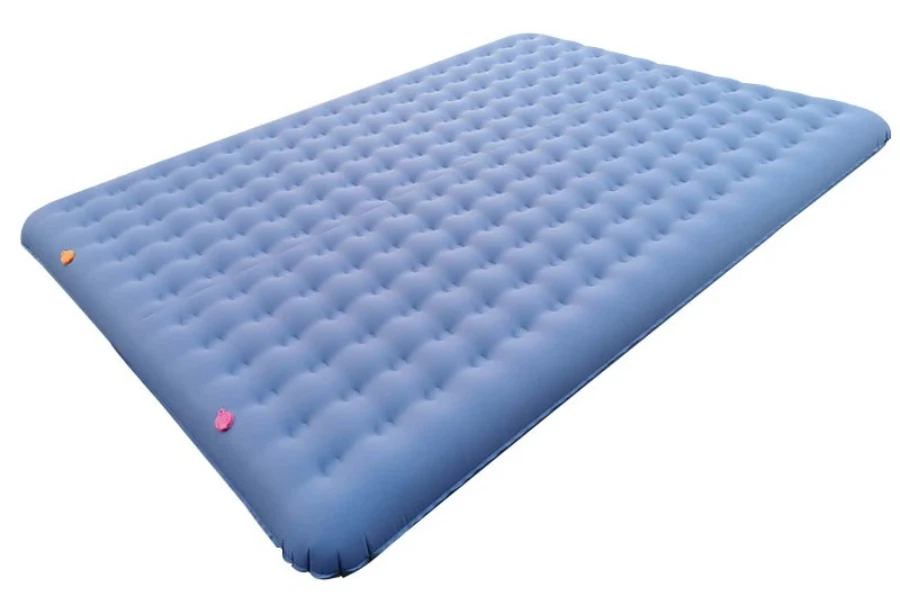 A blue self-inflating camping mattress on a white background