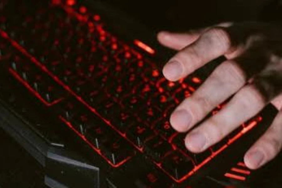 A gamer pressing some keys on a hybrid gaming keyboard