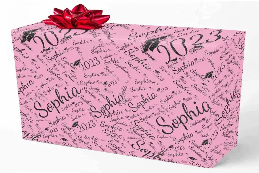 A gift wrapped in a pink custom wrapping paper
