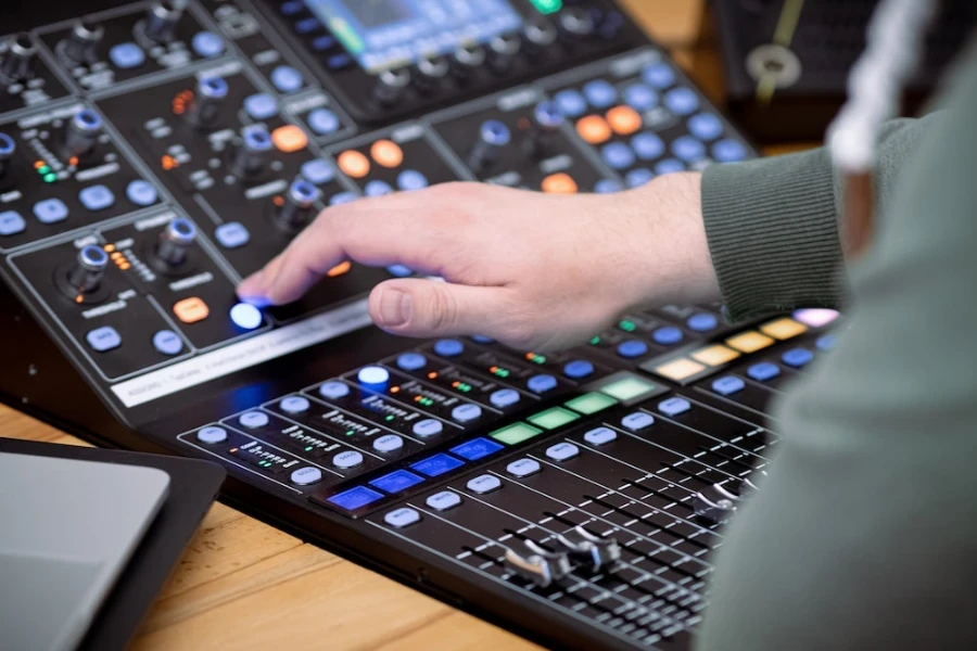 A person using an audio mixer