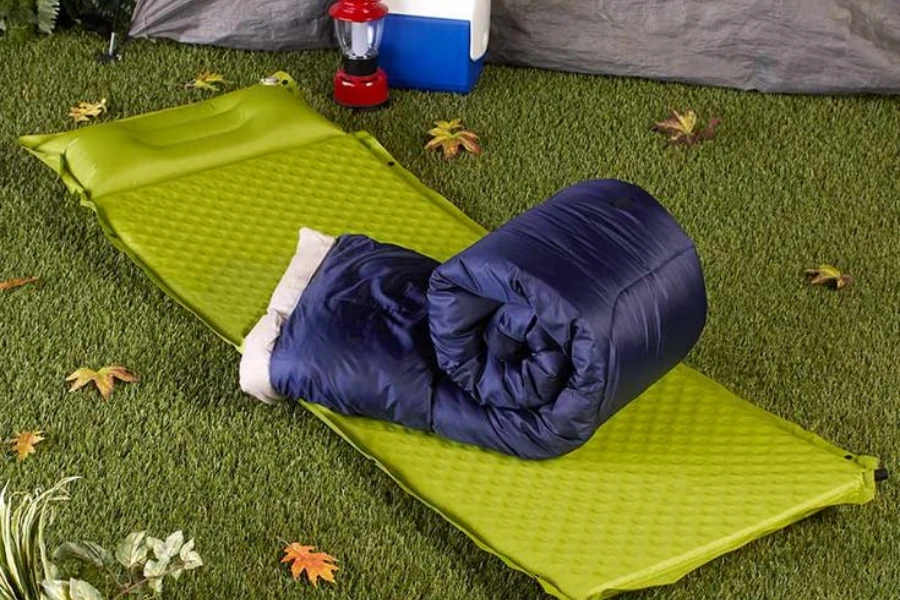 A purple closed-foam camping mattress with a purple blanket