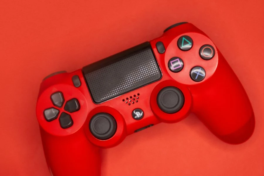 A red game controller on red background