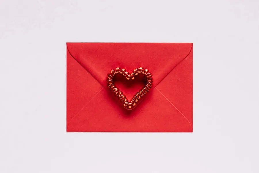 A red gift envelope with heart