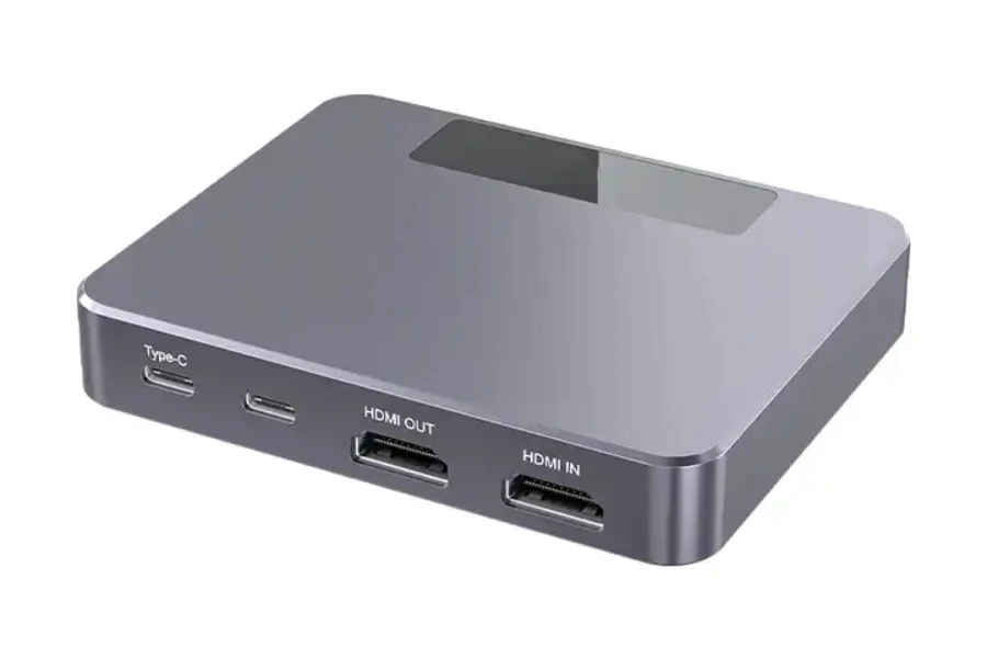 A silver capture card on a white background