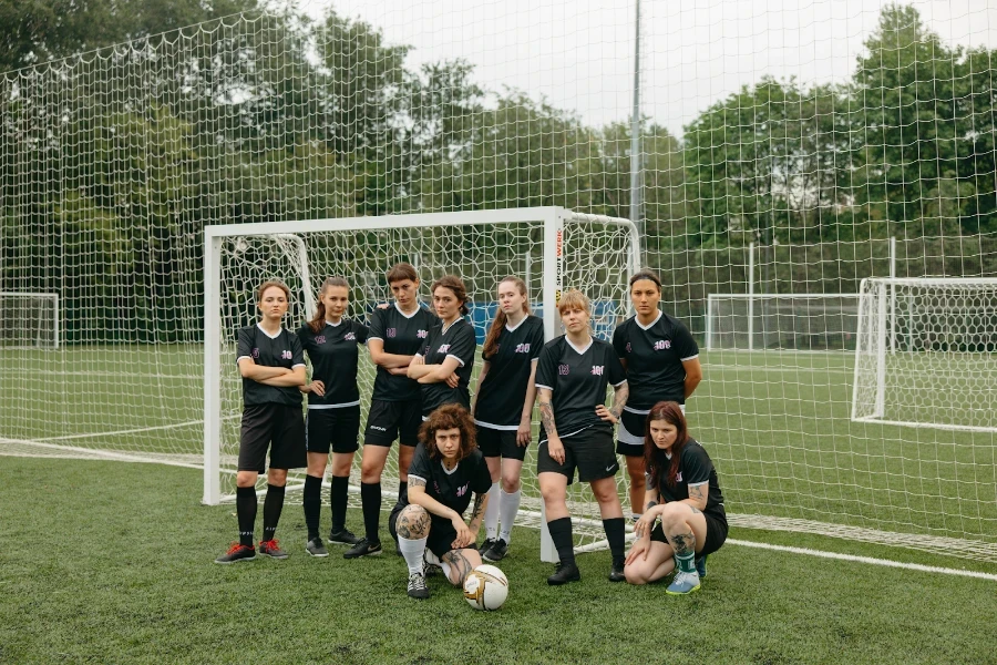 A team standing in front of a portable goal