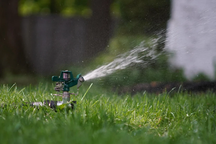 A traditional hose and sprinkler irrigation system
