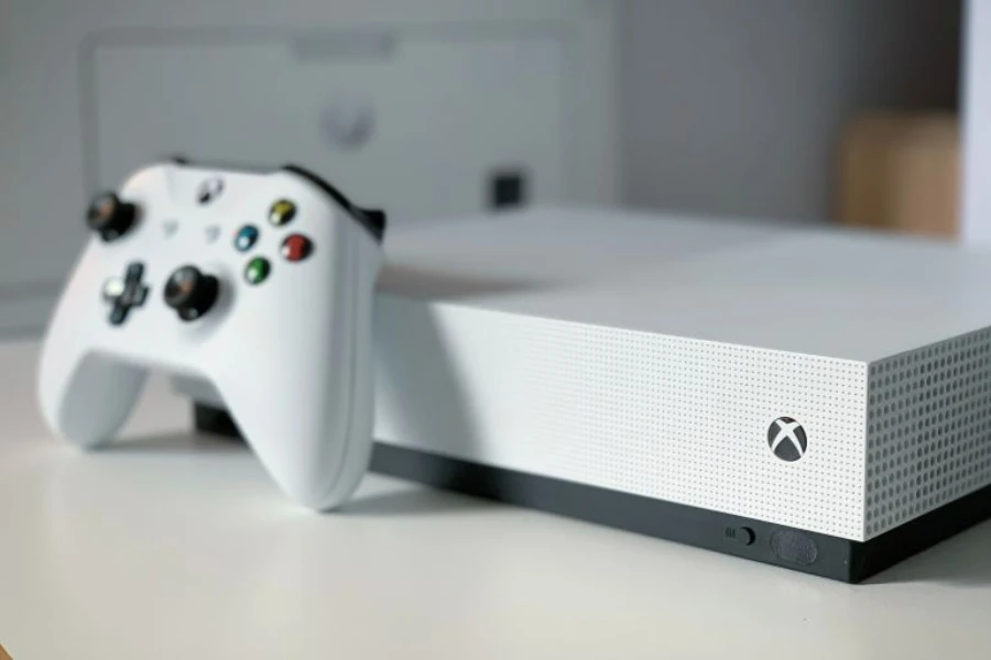 a white xbox console on white surface
