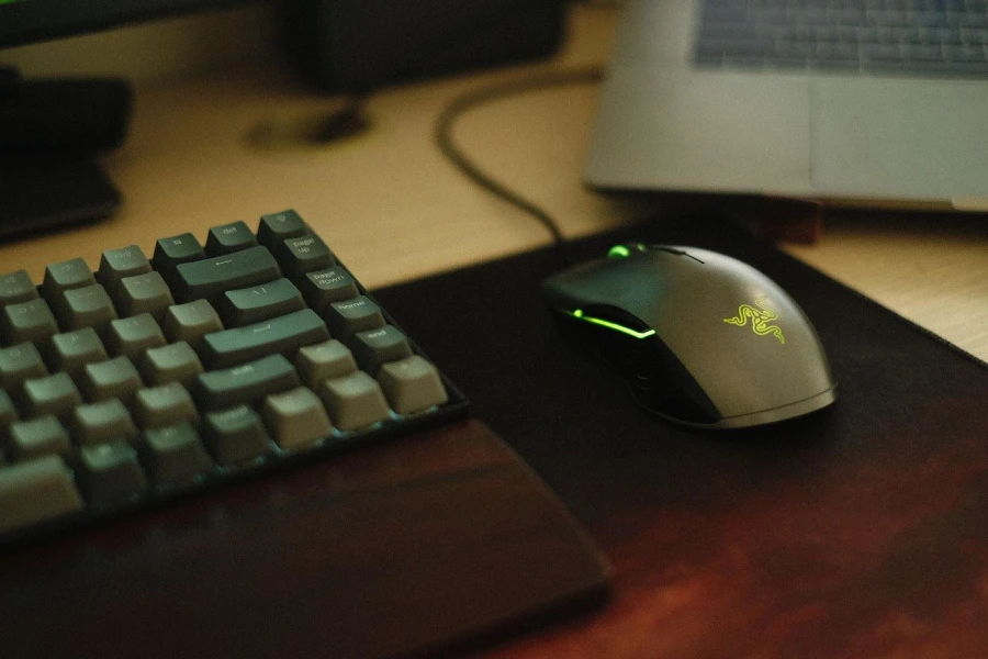 A wired gaming mouse with glowing green details