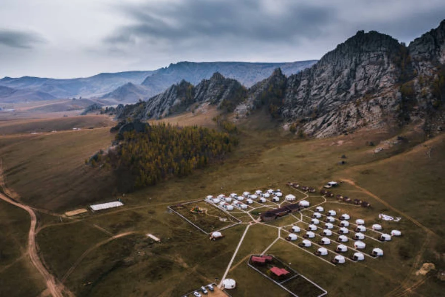 Aerial view of a glamping site with yurt tents