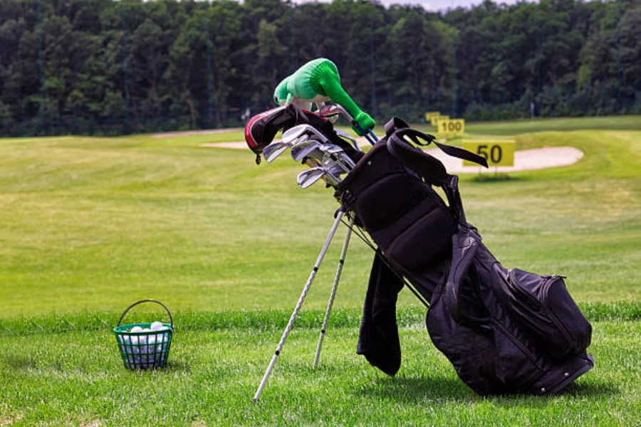 Black golf club bag with set of golf clubs inside