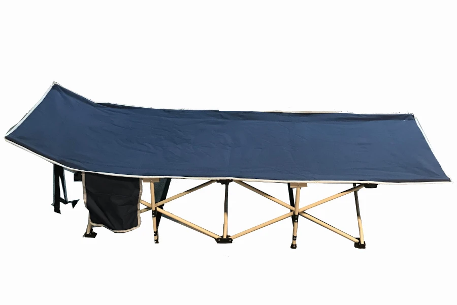 Blue camping cot with a canvas pad