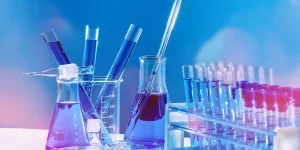 Collection of medical flasks on a blue background