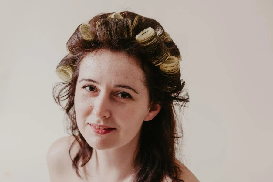 Female using velcro hair rollers