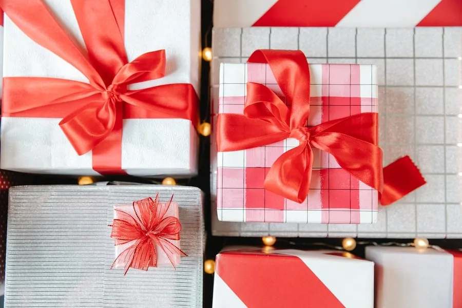 Gift boxes wrapped with red ribbons