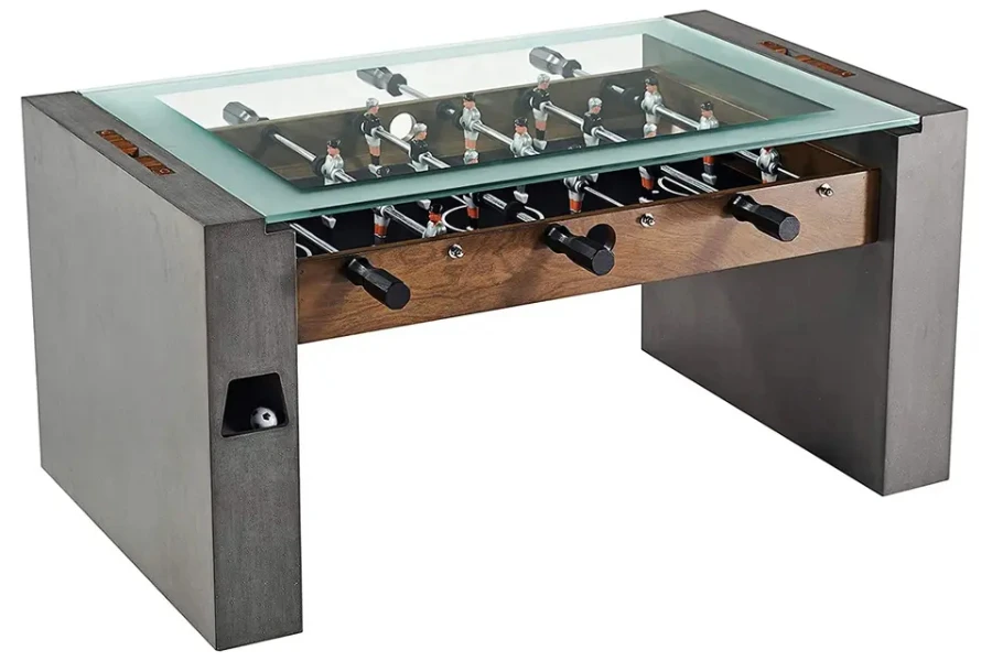 Gray concrete foosball table with glass covering playing area