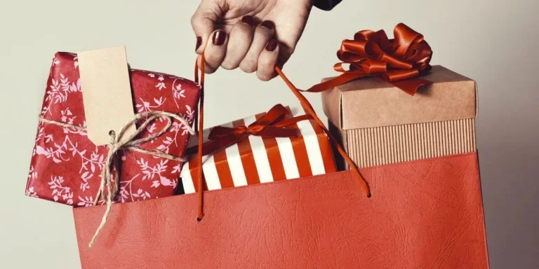 Hand holding Christmas gifting products