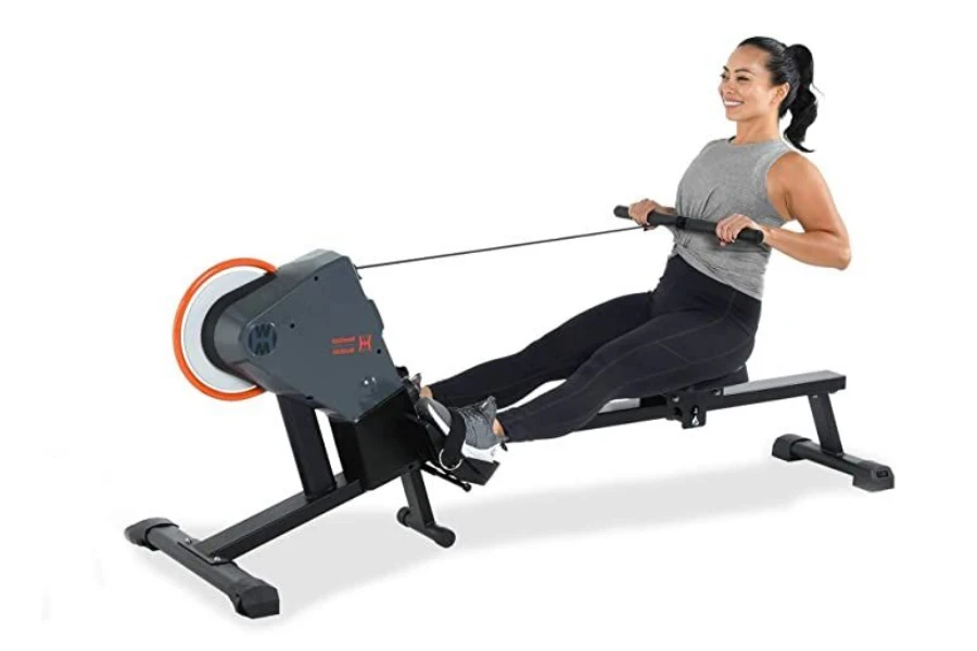 Lady using a smart rowing machine in full swing