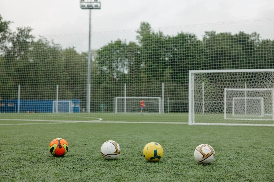 Lined up training footballs ready for use