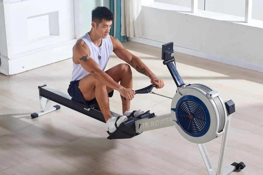 Man using a smart rowing machine