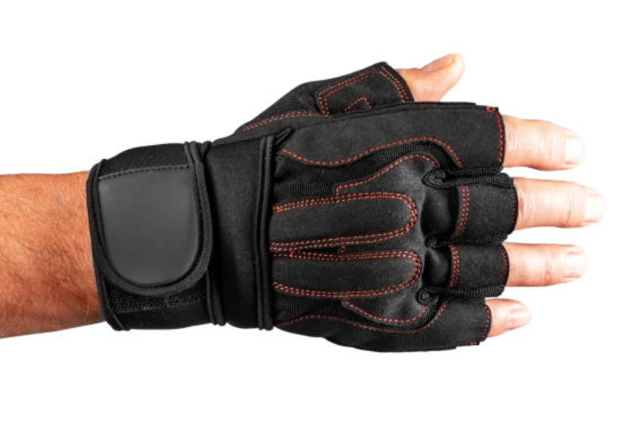 Man wearing black fingerless gloves with additional wrist support
