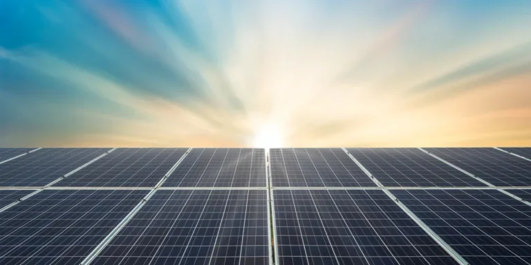 Solar panel cell on dramatic sunset sky background