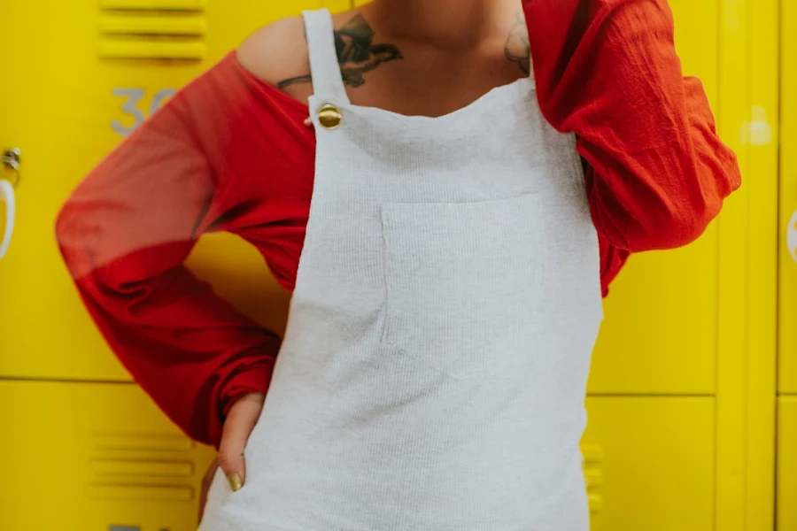 Woman posing in white overalls