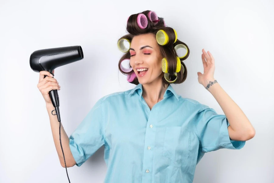 Young lady wearing hot hair rollers