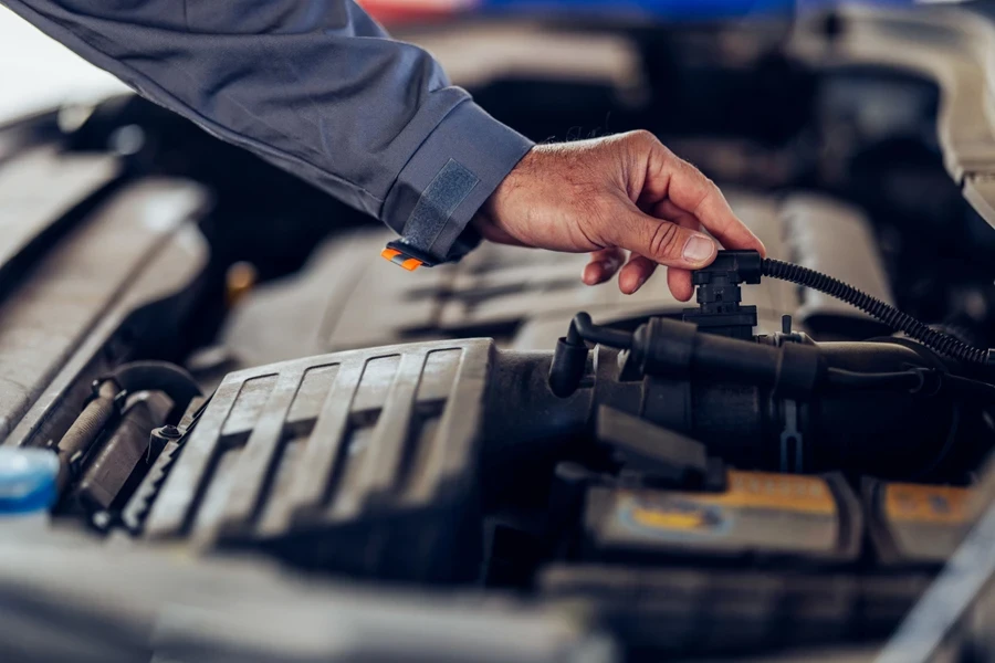 A mechanic carrying out a car diagnosis