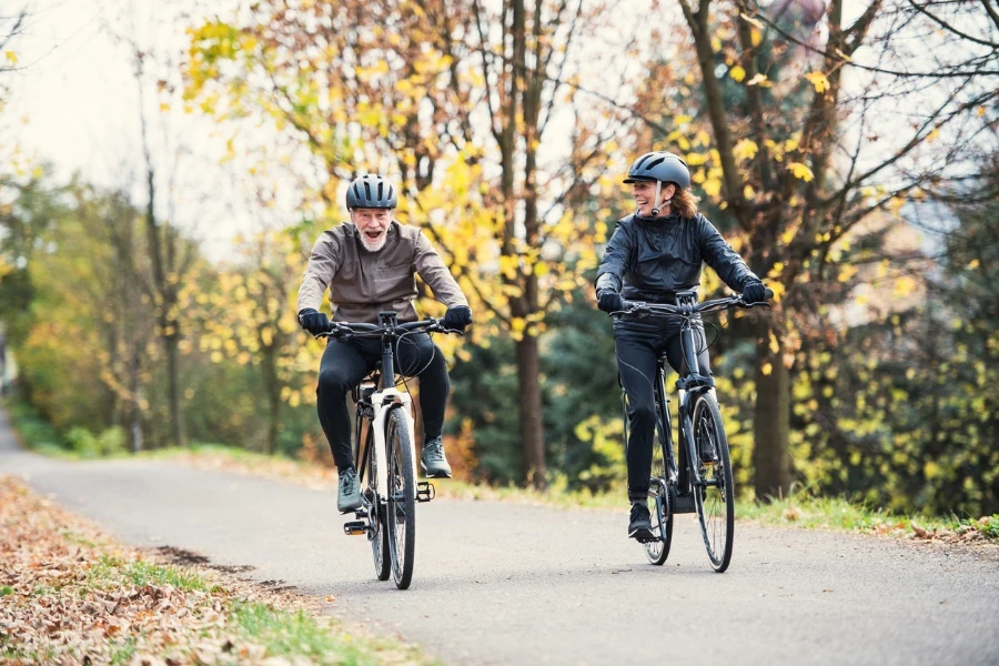 A senior couple riding electrobikes